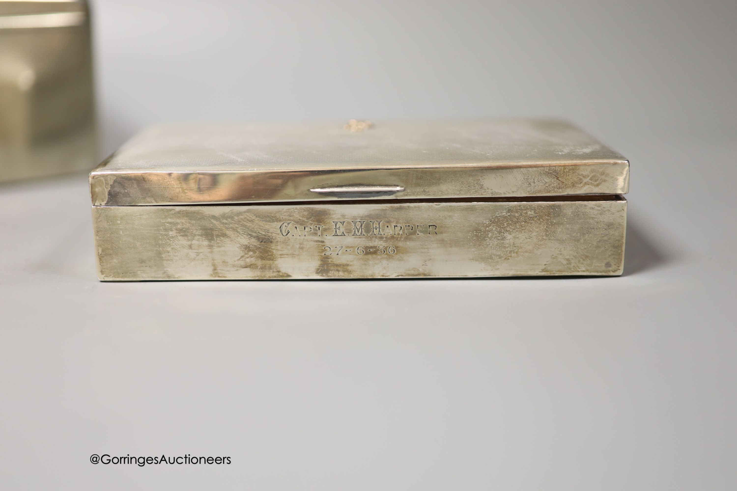 Three 20th century silver mounted cigarette boxes, two with engraved signatures, largest 16.2cm.